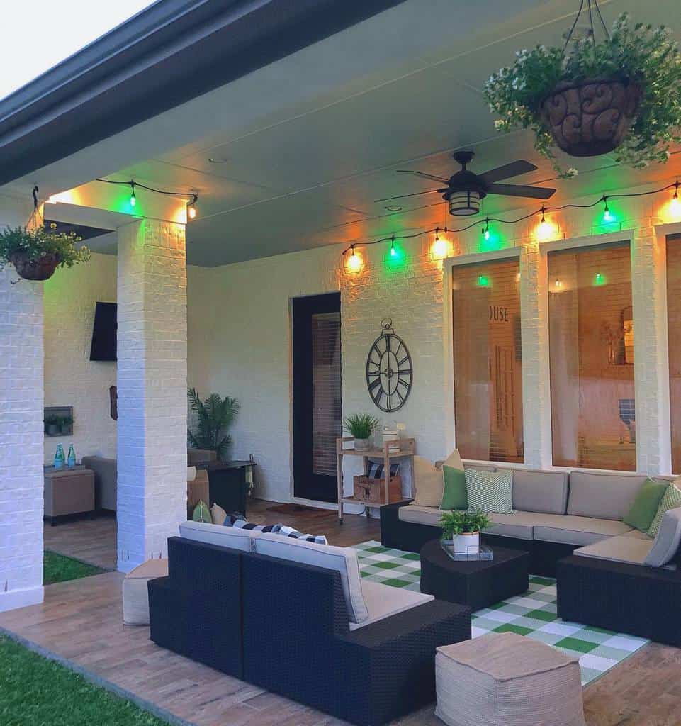 porch-patio-lighting-ideas-harknesshomestylist green lights backyard patio porch with wicker furniture