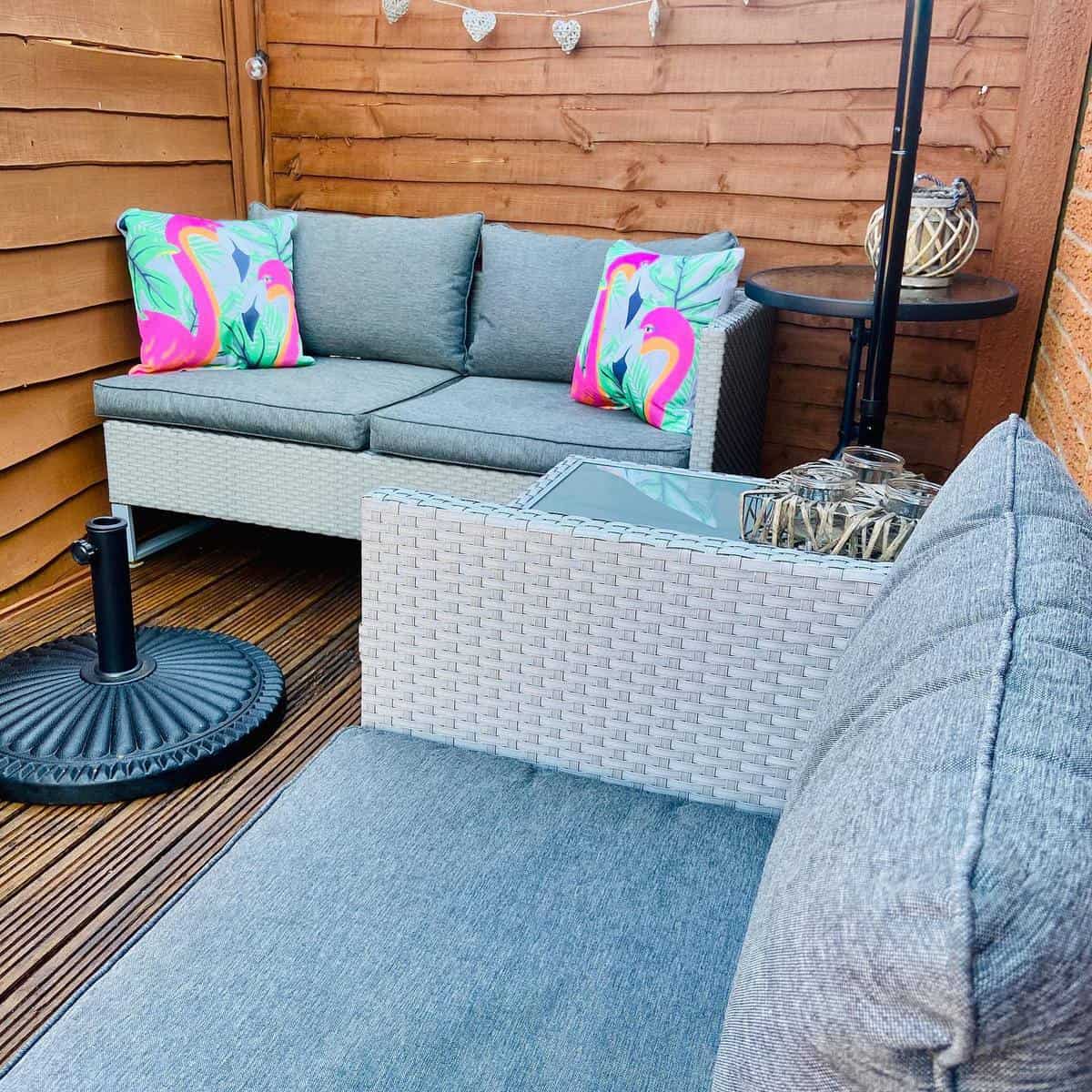 privacy-patio-enclosure-ideas-our_cosylittlehouse small corner patio deck with wicker furniture