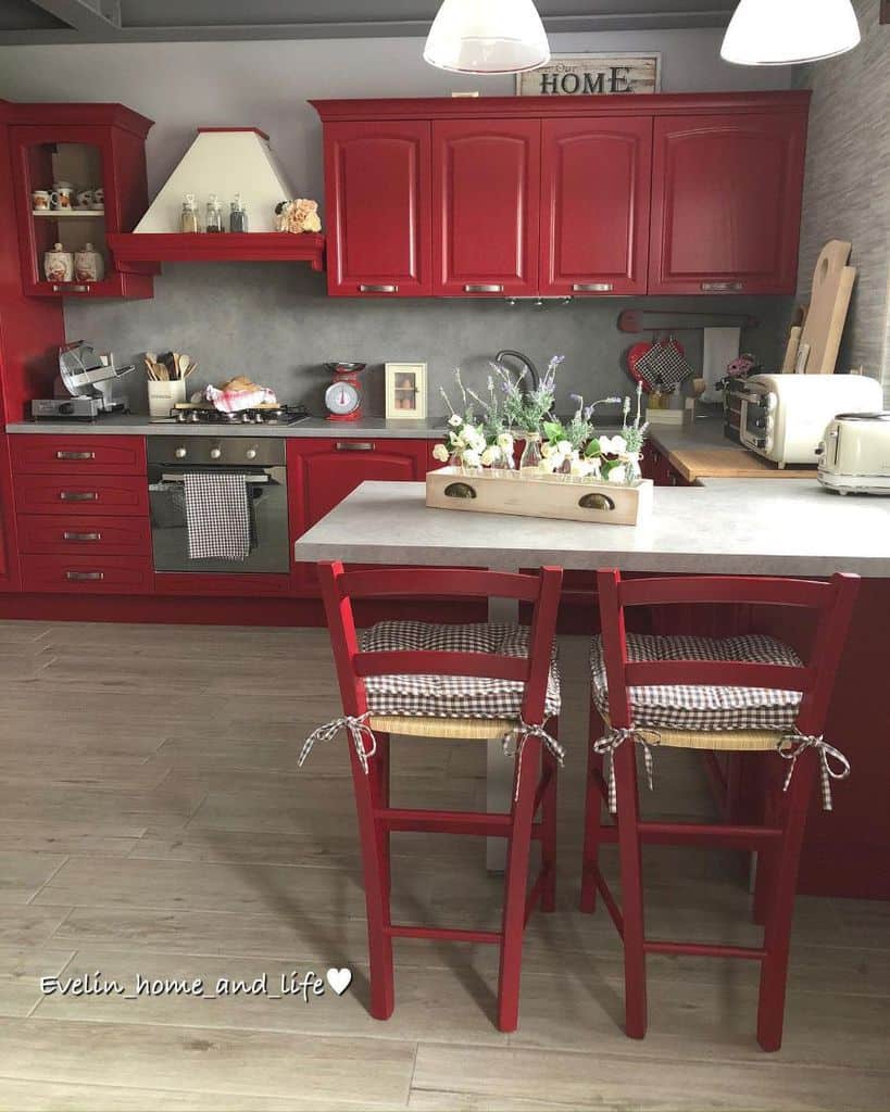 red kitchen cabinets and chairs