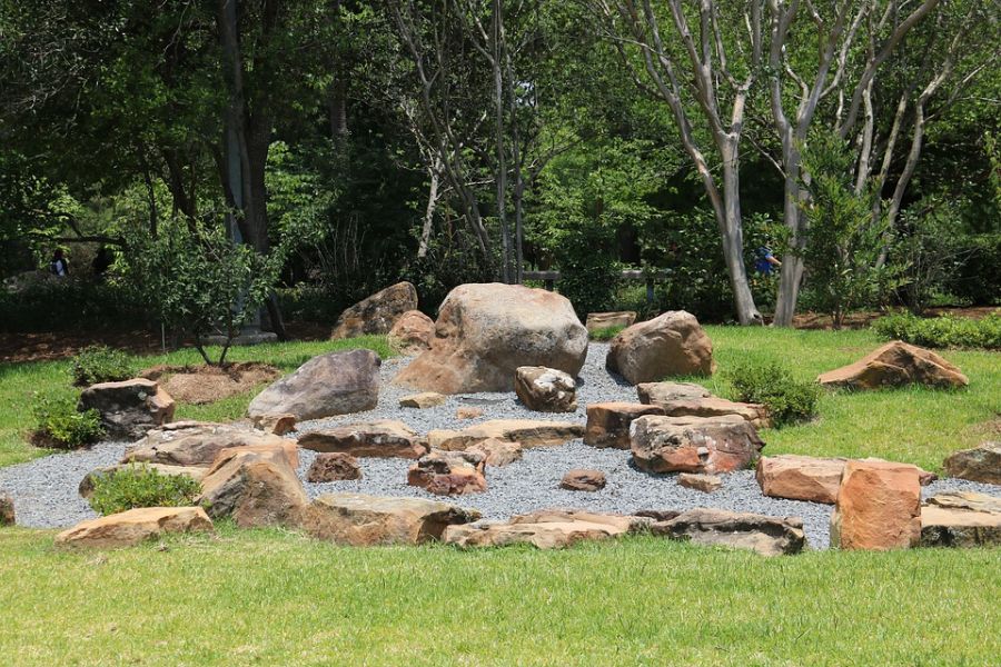 rock-zen-garden-ideas-5 backyard rock garden with gravel path surrounded by grass