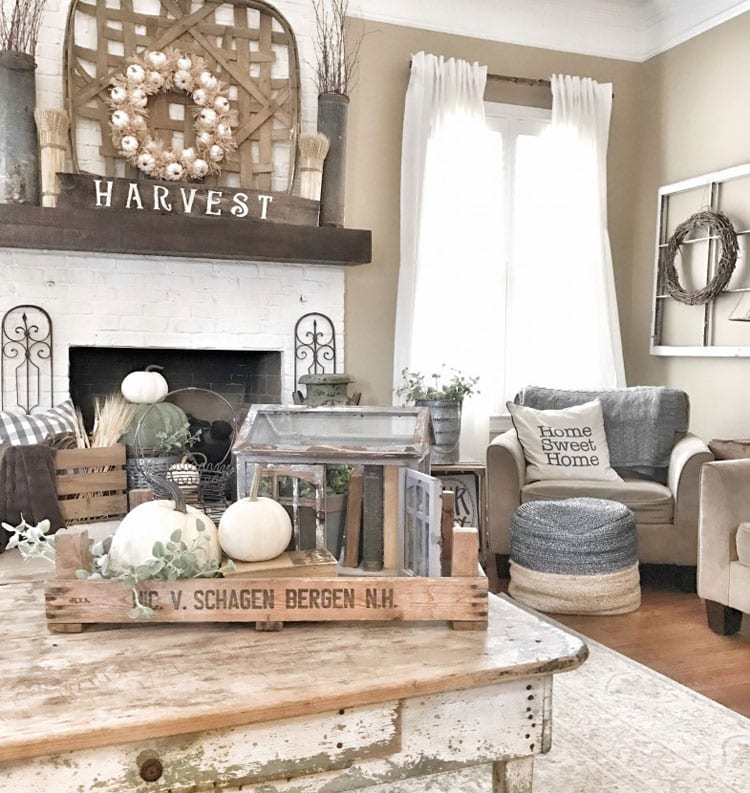 Rustic Farmhouse Living Room with Table Decorations and Wall Hangings