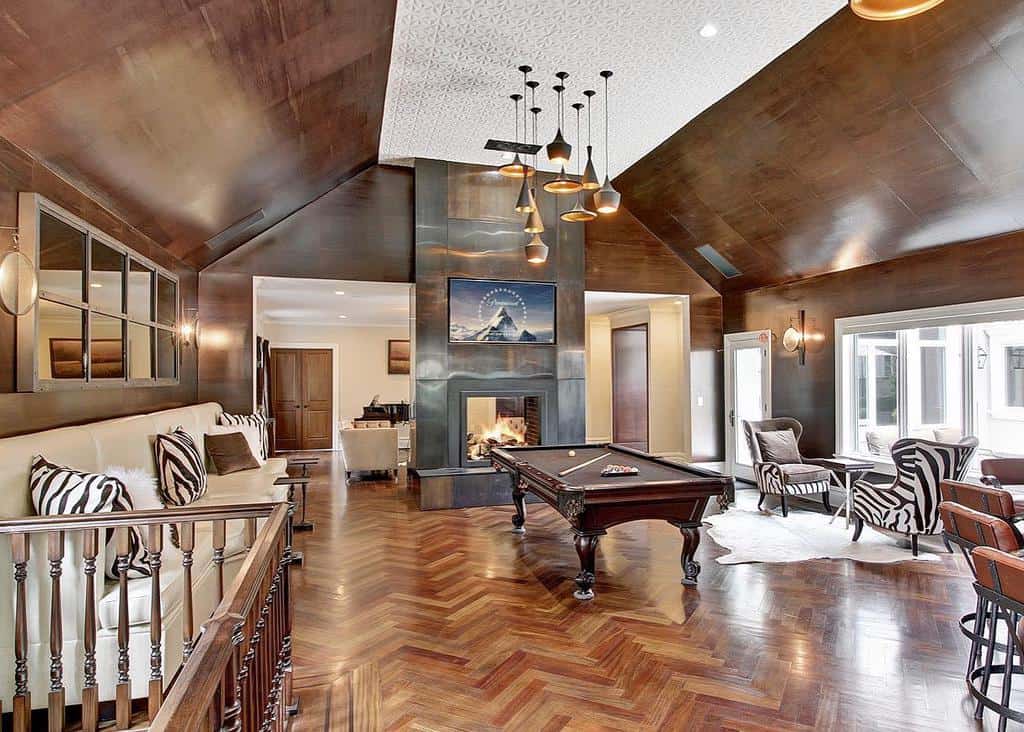 rustic-fireplace-wall-ideas-traceybhomeinteriors large rustic living space fireplace billiards table sofa table and chairs