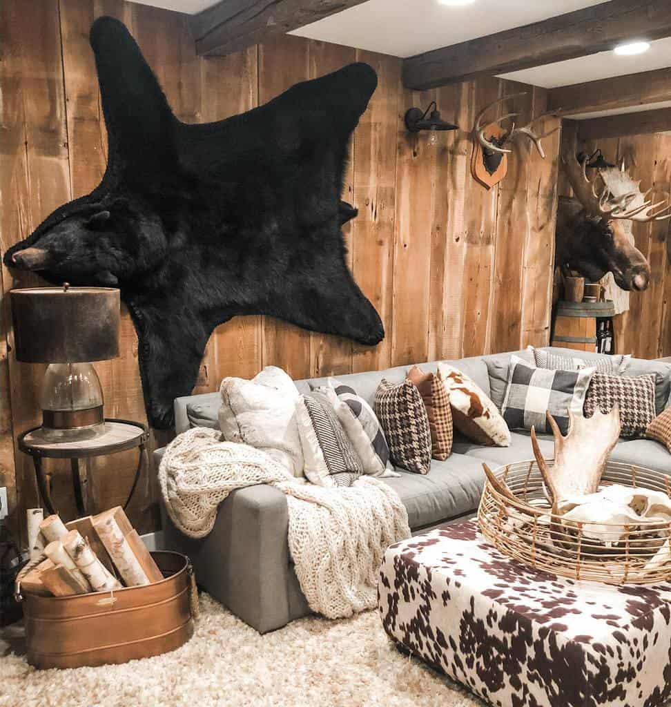 rustic small basement living room with stuffed bear wall art