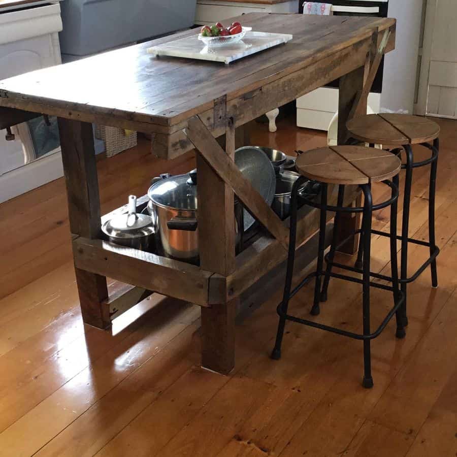 rustic wood table island in farmhouse kitchen