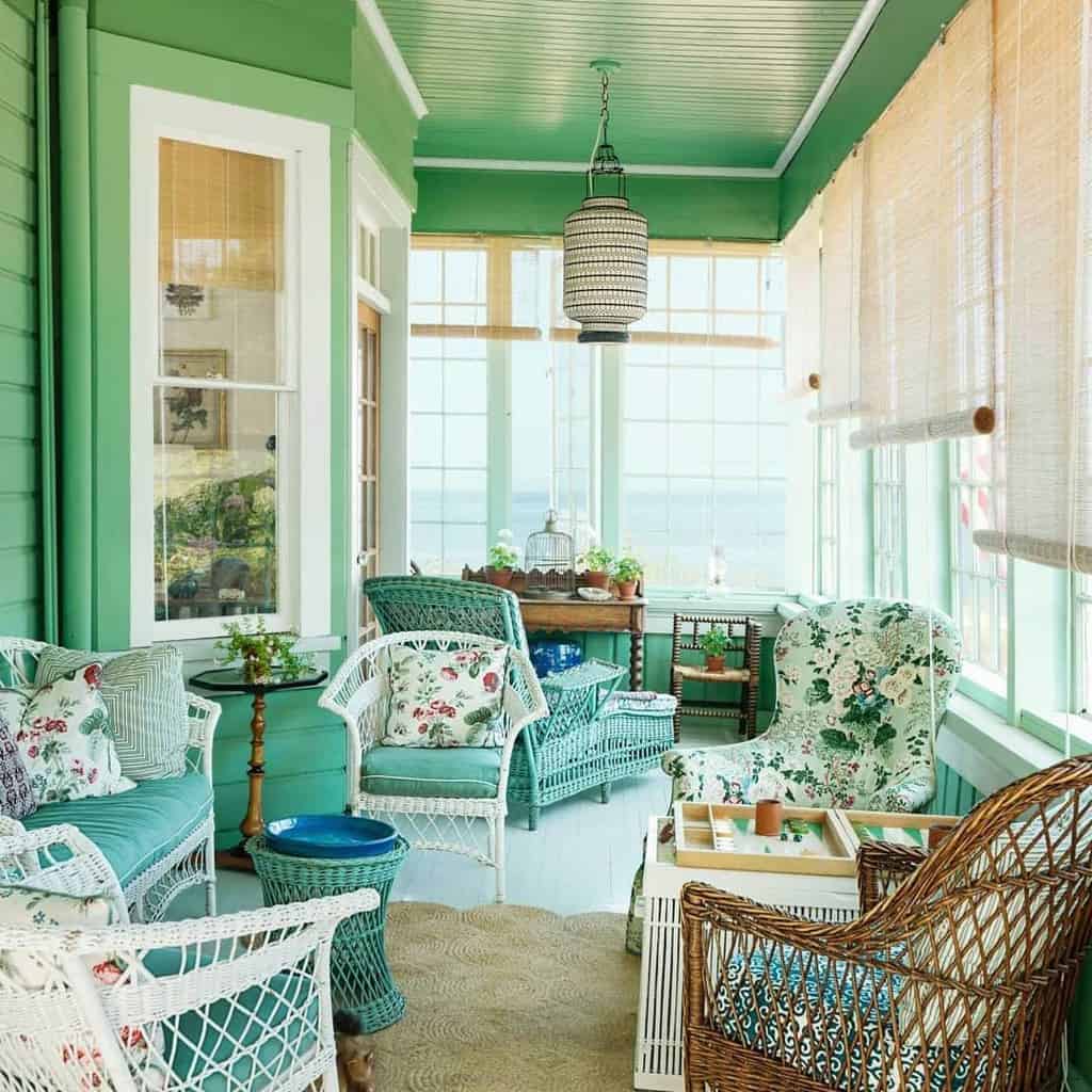screened covered patio green and white wicker furniture
