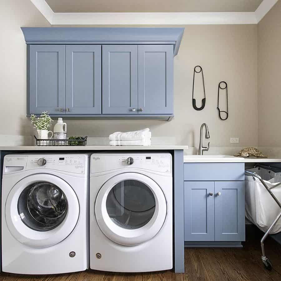 small-laundry-room-sink-ideas-kanehomecabinetryanddesign small laundry room blue cabinets sink washer and dryer