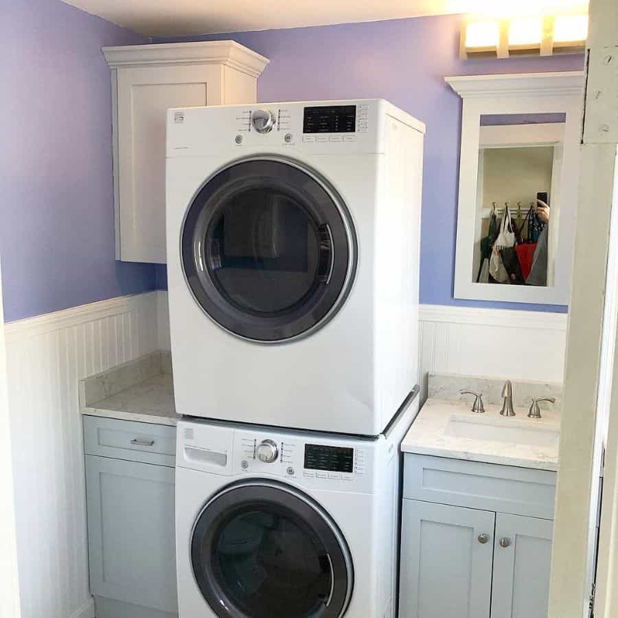 small-laundry-room-sink-ideas-masselitecarpentry small laundry room sink purple wall stacked washer and dryer