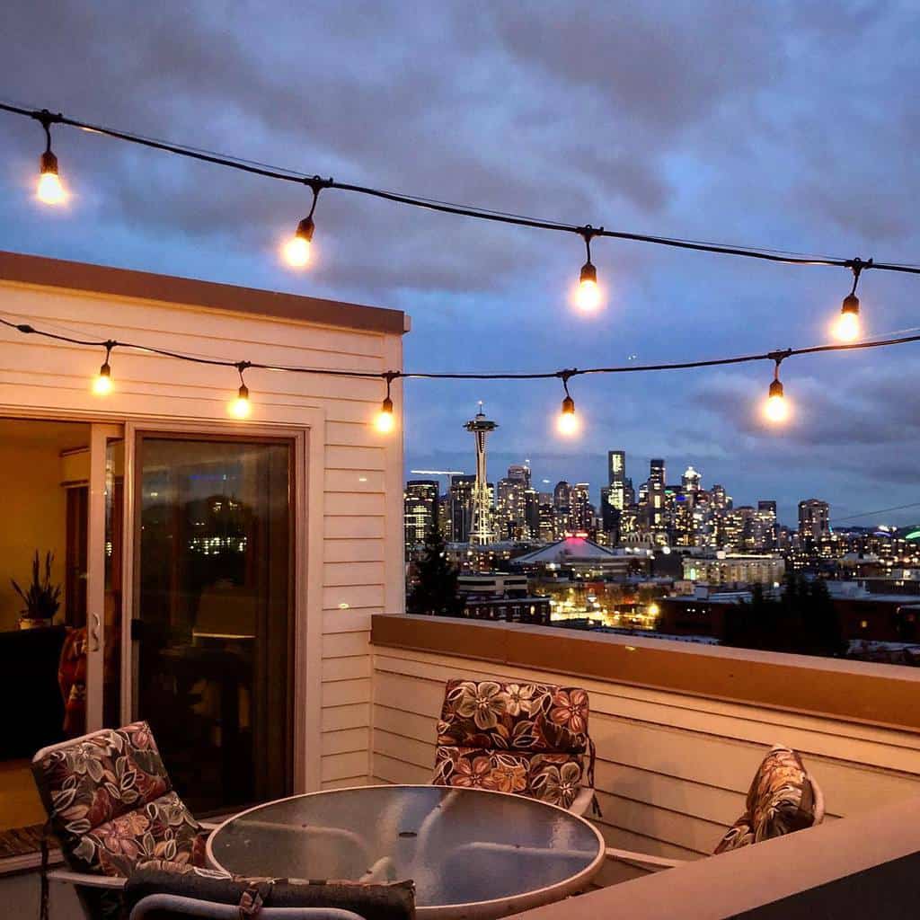 string-lights-patio-lighting-ideas-stevestroh86 rooftop patio with string lights