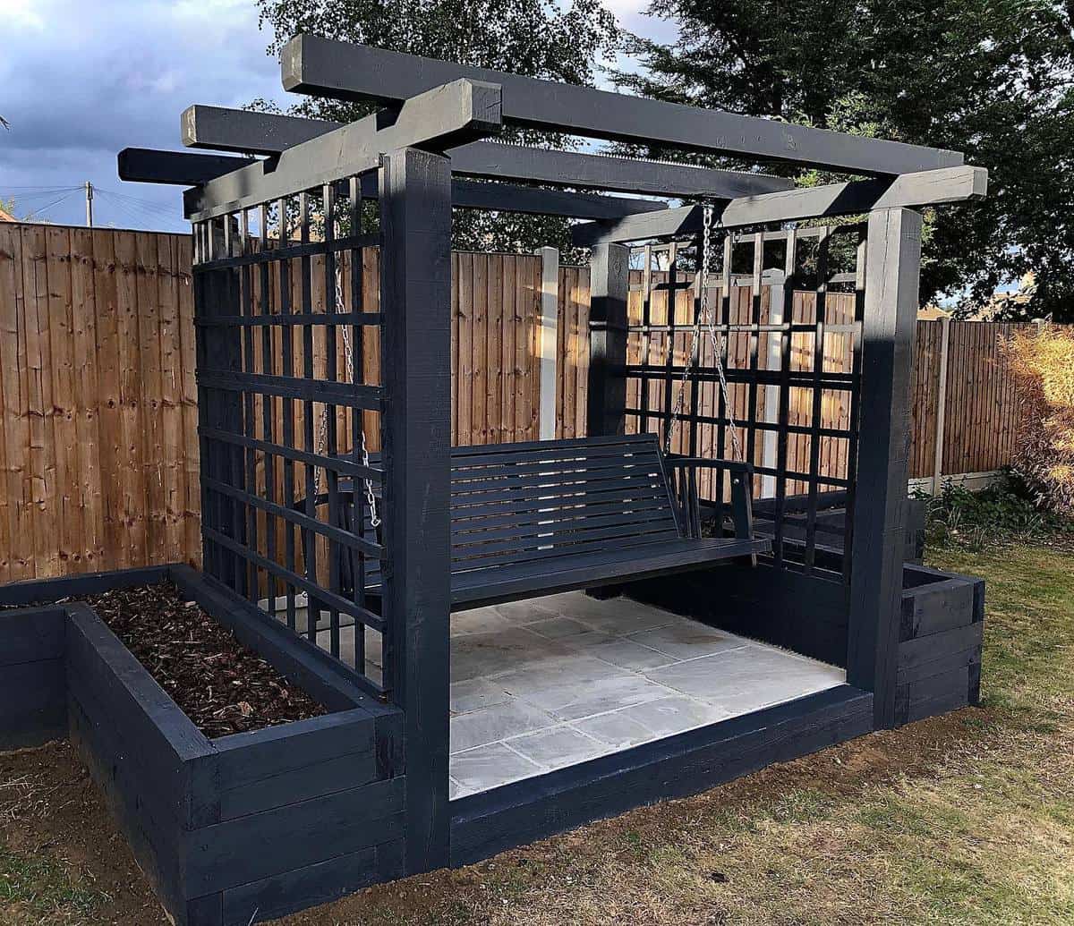 swing-bench-garden-bench-ideas-kings-landscapes black wood swing bench gazebo tile paver floor garden planters