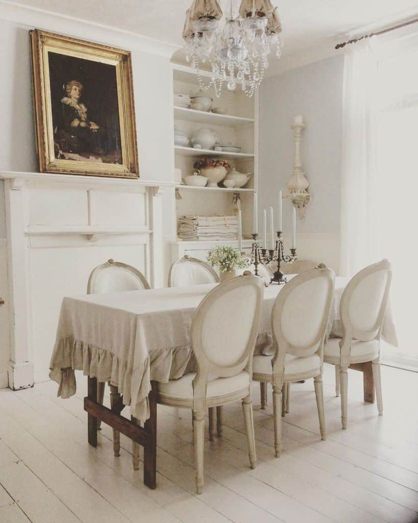 table-centerpiece-dining-room-lighting-ideas-weatheredandwhitevintage rustic dining room table and chairs table candles framed painting glass chandelier