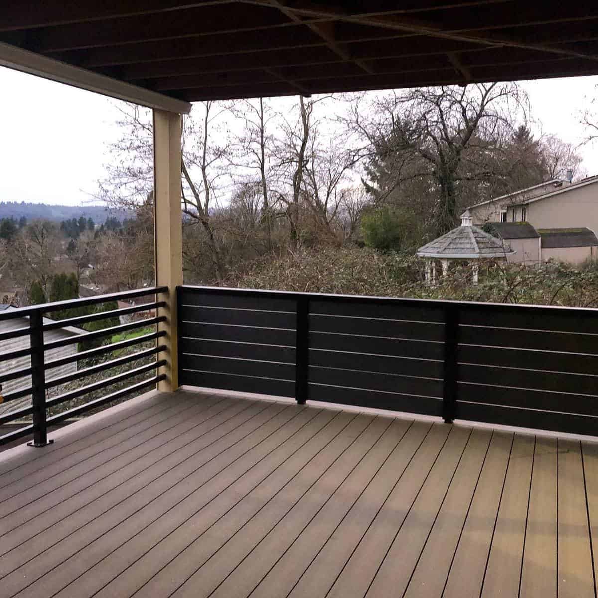 simple empty wood deck with railing