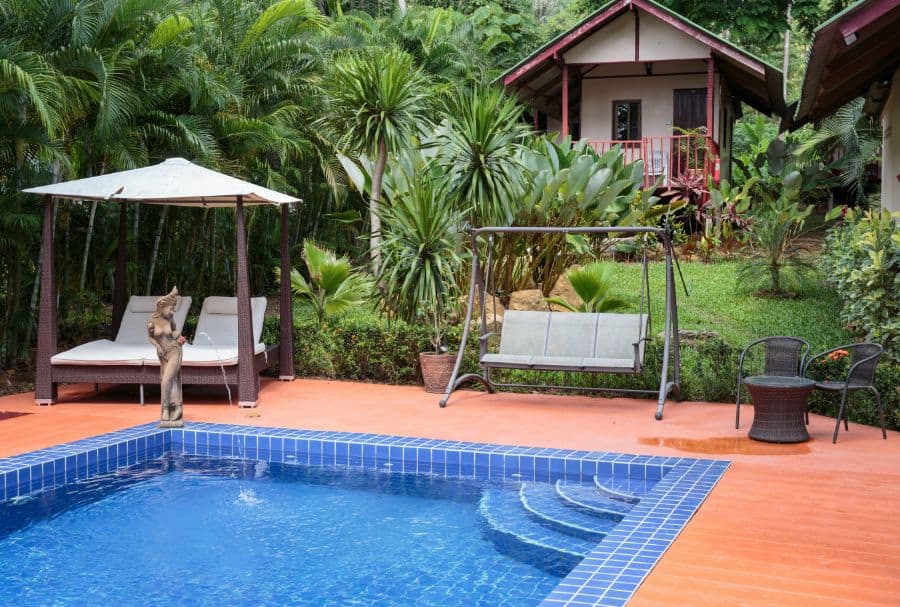 tiles-pool-deck-ideas-14 wood deck pool patio with swing seating