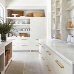 large white kitchen marble countertops gold accents tile floor