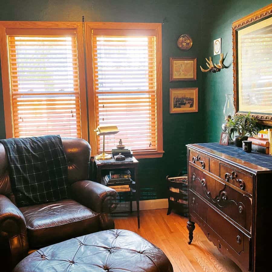 vintage study with green walls and leather sofa chair
