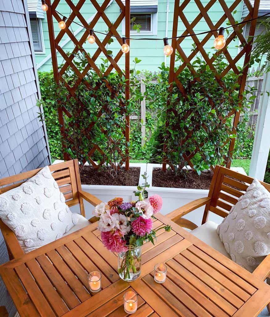 trellis for small pots and raised garden wood table and chairs candles