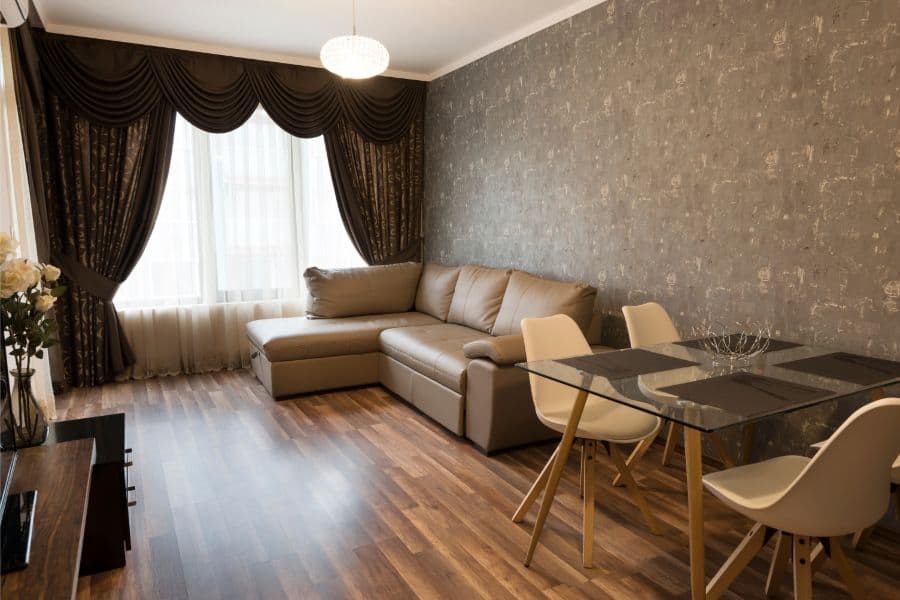 modern living room with sofa and glass dining table