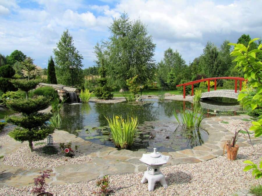 water-feature-zen-garden-ideas-2 large garden with pool and waterfall red bridge small temple statue
