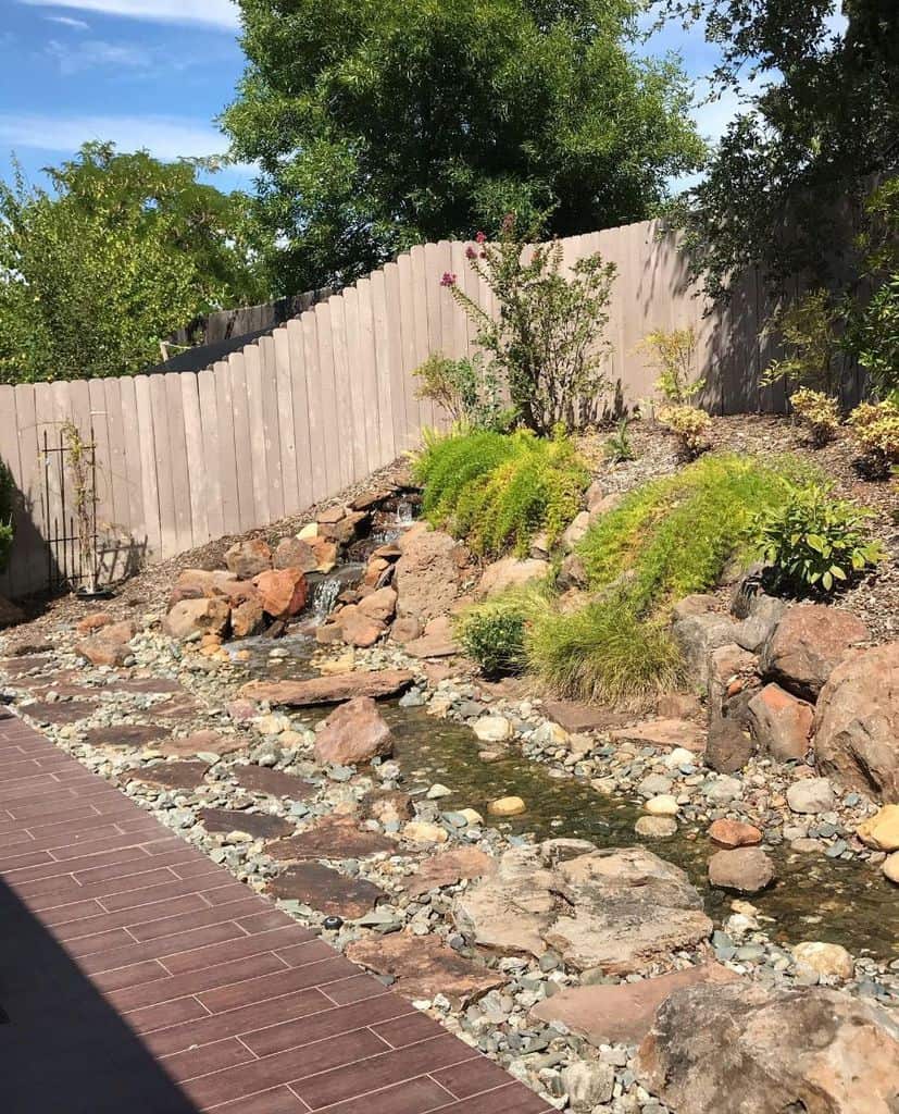 water-feature-zen-garden-ideas-beckisemb flowing creek with waterfall in backyard