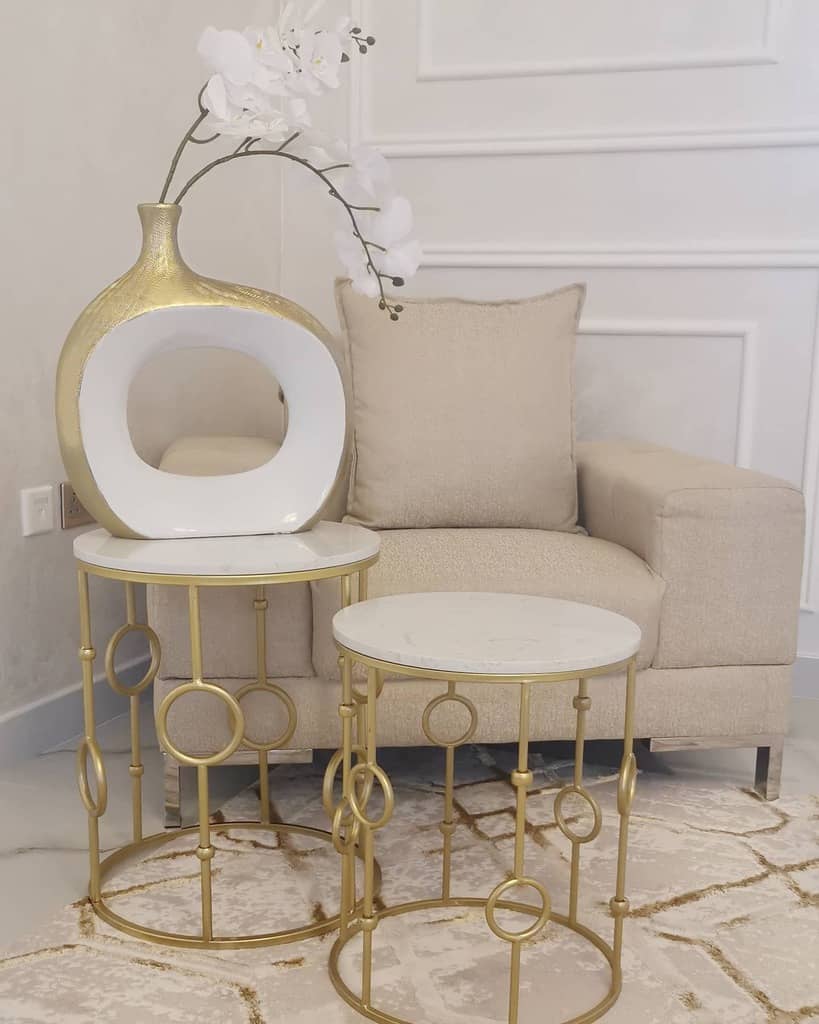 white-wall-paneling-ideas-duchessmanor white wall paneling cream sofa gold coffee table