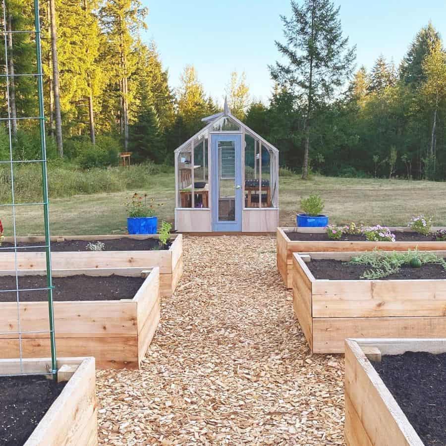 large wood pallet raised garden beds with greenhouse