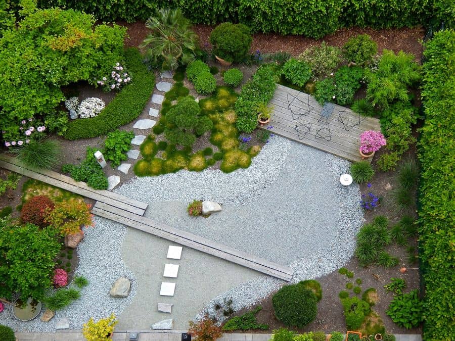 zen-style-landscaped-garden aerial shot of backyard garden with large stone area wood deck green shrubs