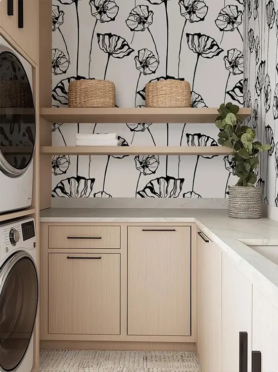Black-white poppy pattern above natural wood cabinets