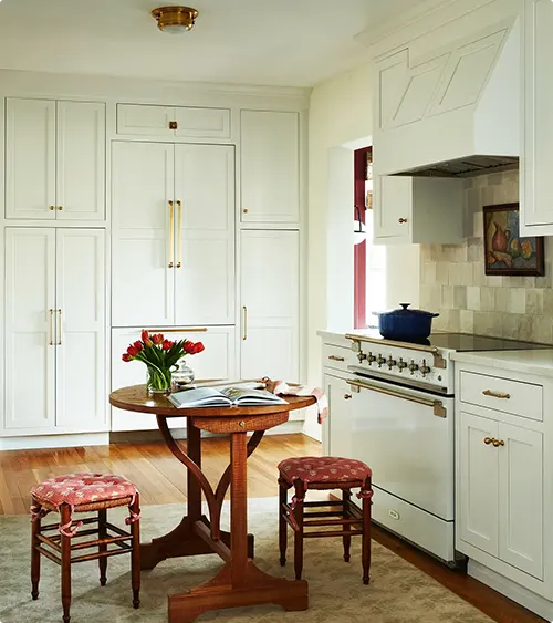Pantry with built-in storage and brass hardware
