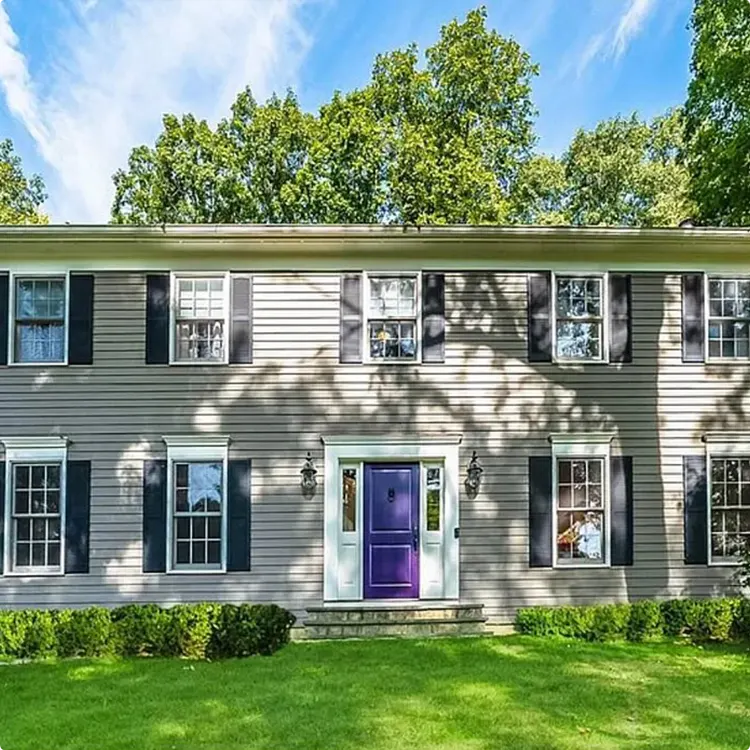 Colonial House With Purple Door