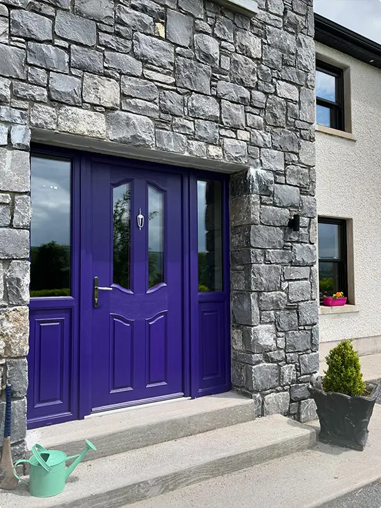 Deep Purple Door in a Gray Stone Exterior Wall
