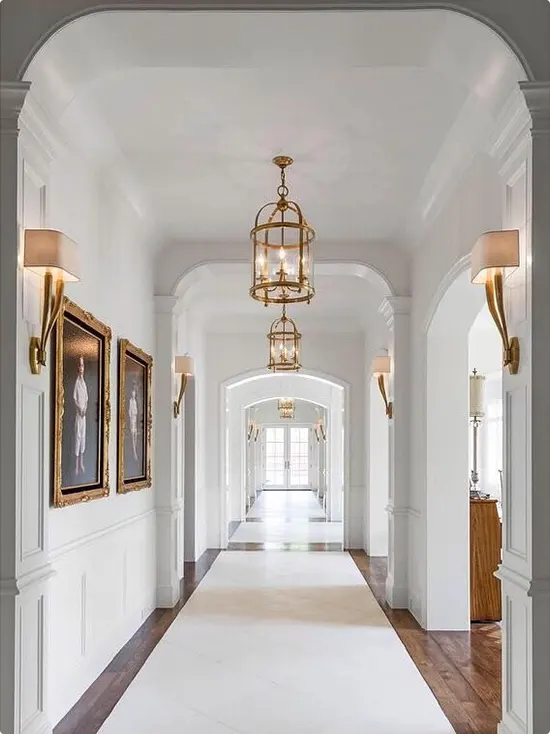 Gold cage pendant lights with white classic millwork