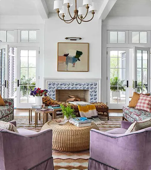 Lavender Seating by a Patterned Tile Fireplace