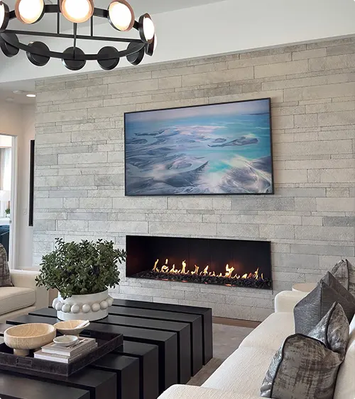 Ocean Art on a Stacked Stone Fireplace Wall