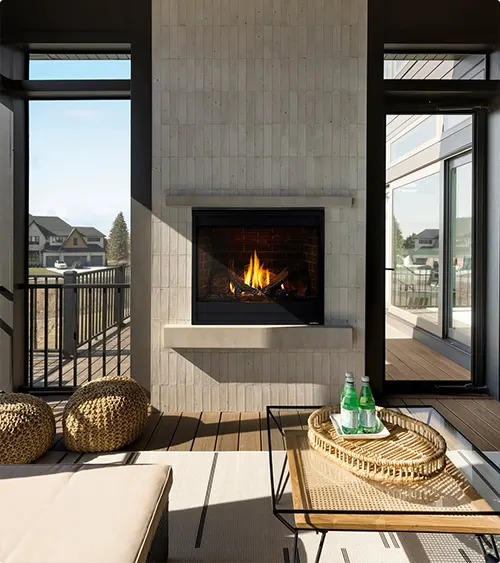 Outdoor Fireplace with a Floating Hearth and Vertical Tile