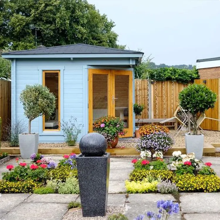 Cabin in powder blue with a garden fountain