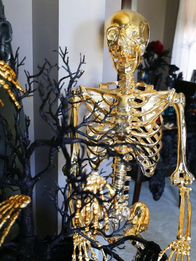 Gold Skeleton in Black Branches
