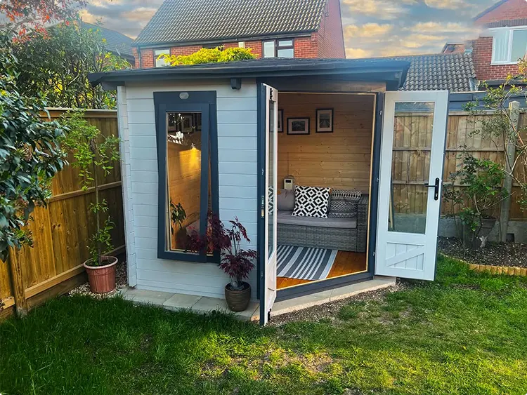 Open Plantation Doors on a White Cabin