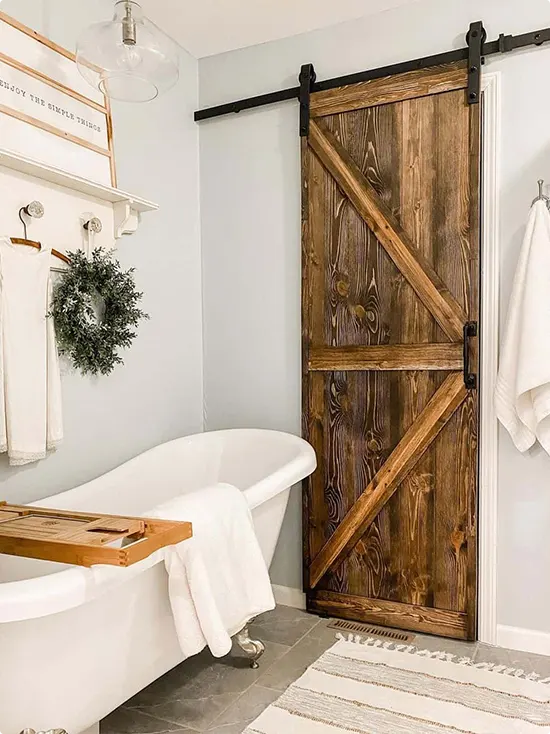Stained Wood Door and Old-Style Clawfoot Tub