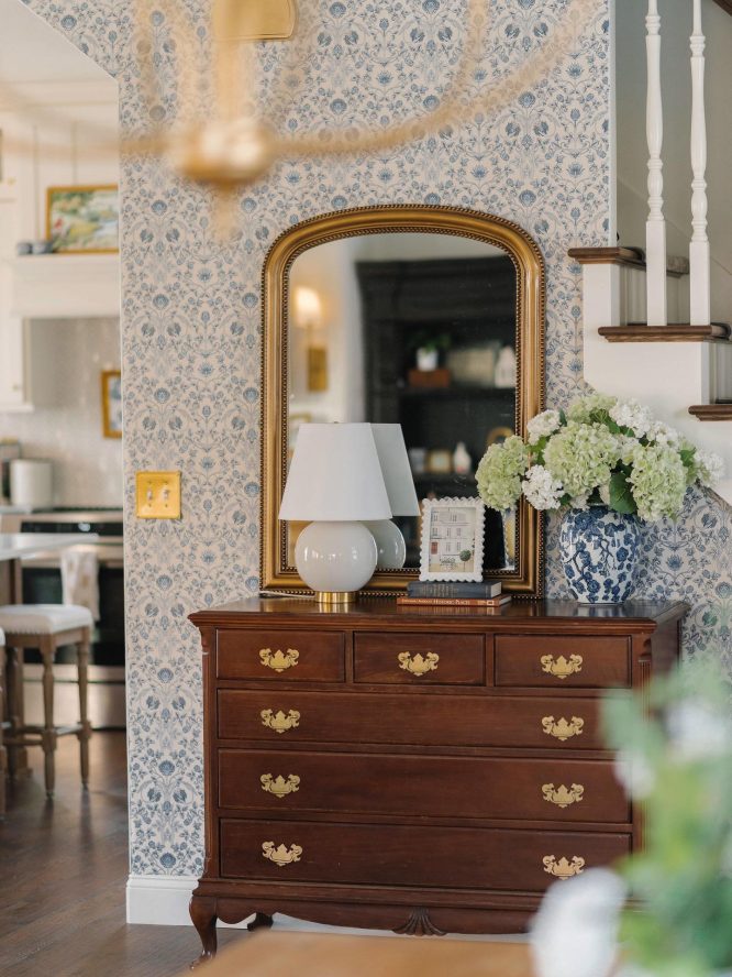 Arched Gold Mirror with Blue Floral Wallpaper