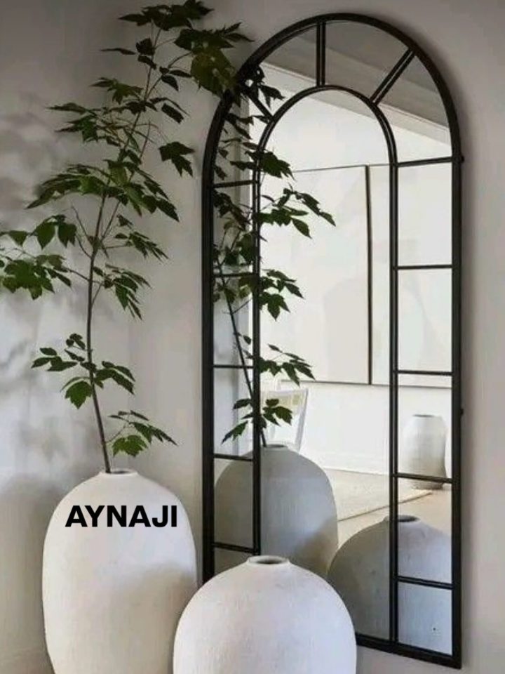 Black Arched Grid Mirror and Sculptural Vases