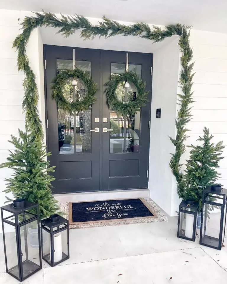 Black Double Doors With Fresh Cedar Garland