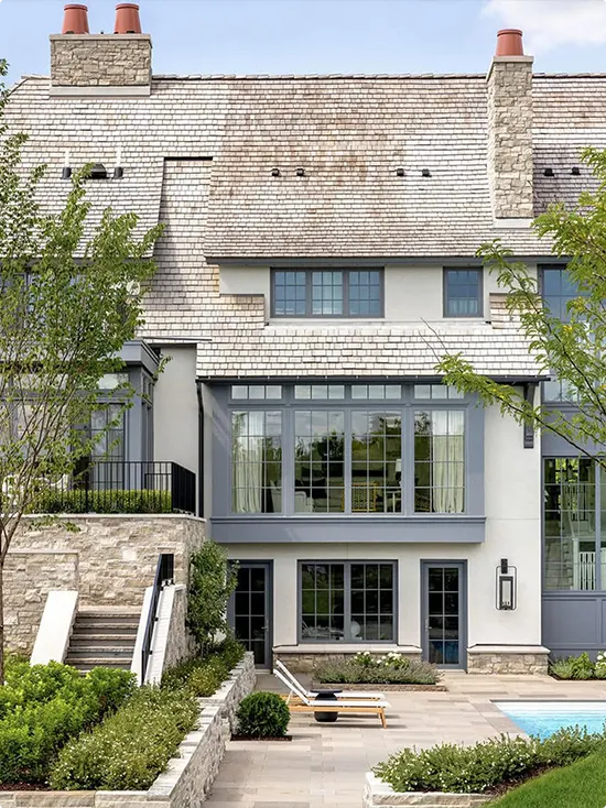 Blue-Gray Trim on a Stone Stucco and Cedar Shake House