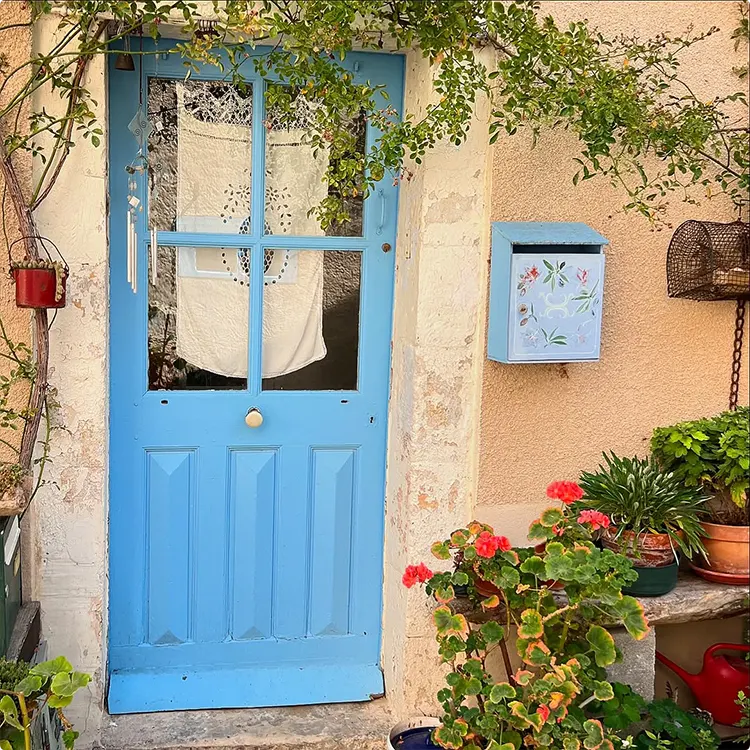 Chipped cottage door in sky blue