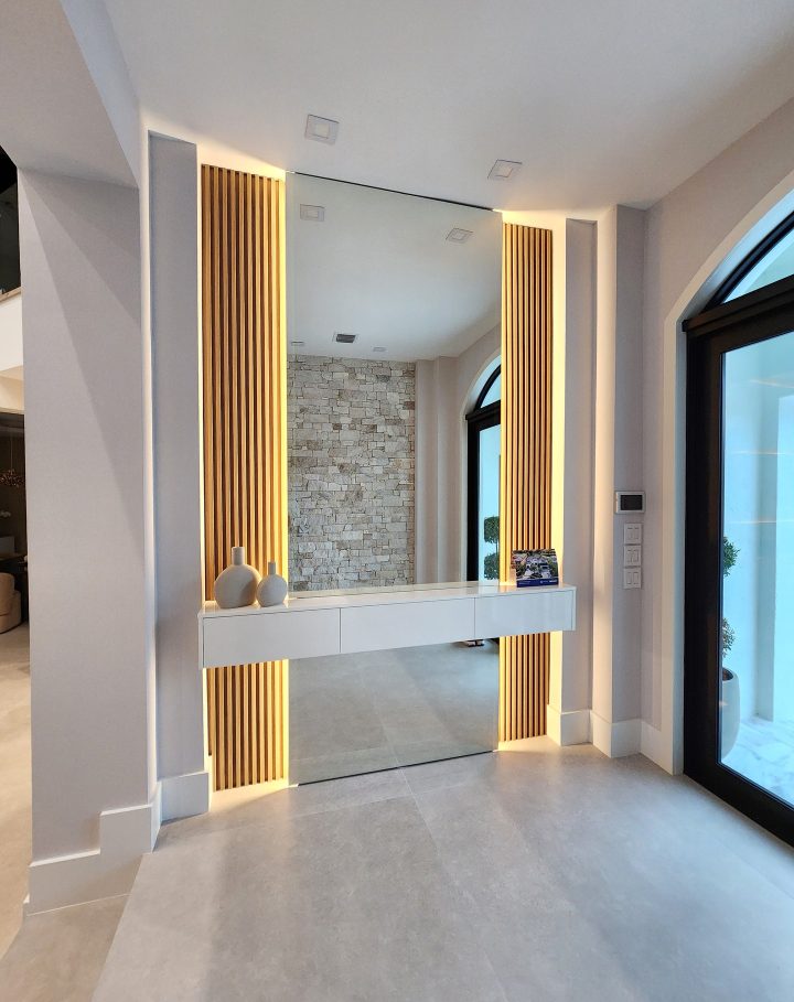 Frameless Mirror in a Wood Slat Niche