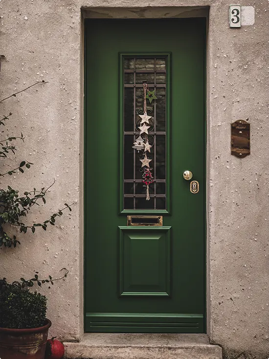 Holiday Garland at a Stucco Entry