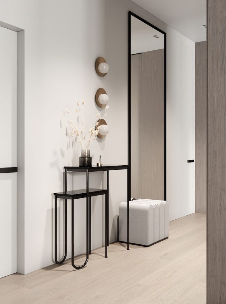 Nested console tables beneath a thin black mirror