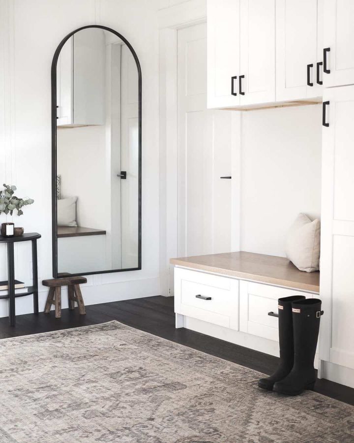 Tall Arched Mirror Beside Built-In Mudroom Bench