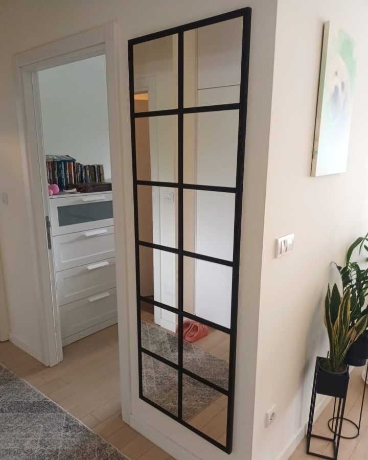 Tall Black Windowpane Mirror in a Corner Nook