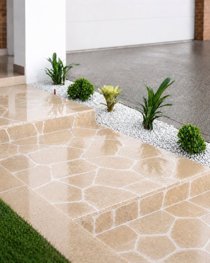 A Border of White Pebbles and Patterned Tile Steps
