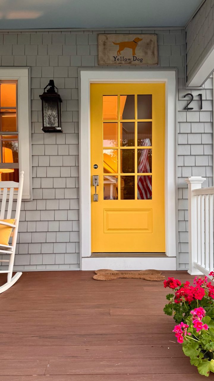 Yellow Dog Sign on a Gray Shingle Porch