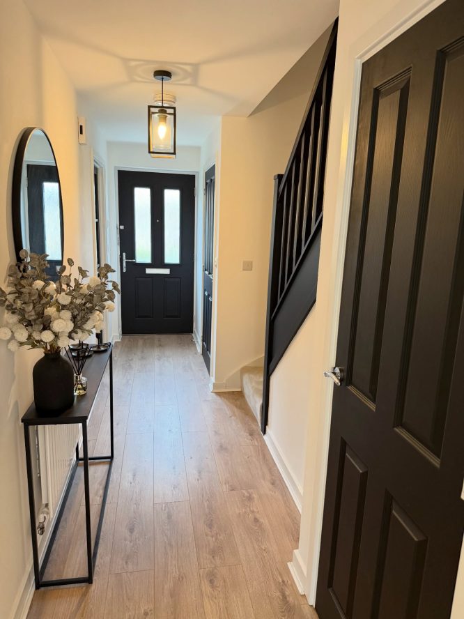 Black Door with Oval Mirror
